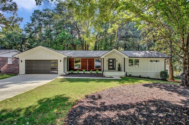 ranch-style house with a garage and a front yard