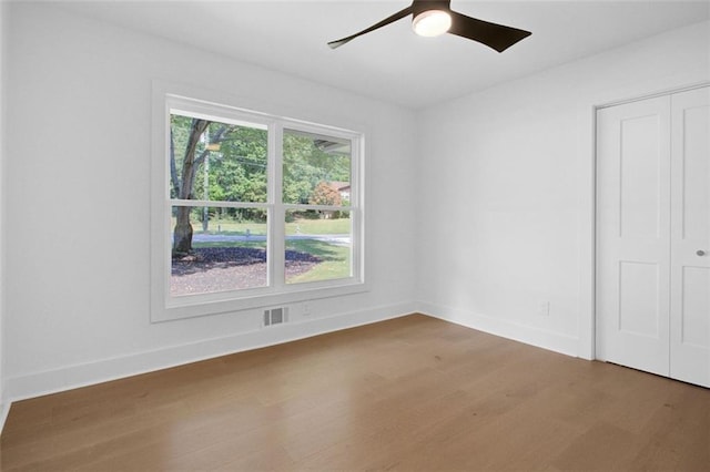 unfurnished room featuring wood-type flooring and ceiling fan