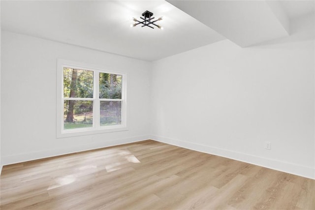 unfurnished room featuring light hardwood / wood-style flooring