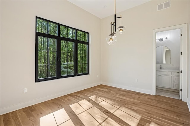 4235 Drew Campground Rd, Alpharetta, GA 30004 - unfurnished room featuring a sink, light wood-type flooring, and baseboards