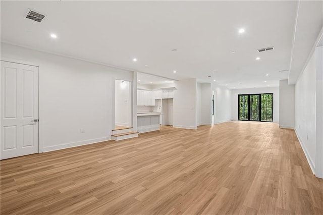 4235 Drew Campground Rd, Alpharetta, GA 30004 - unfurnished living room featuring light wood-type flooring, recessed lighting, and baseboards