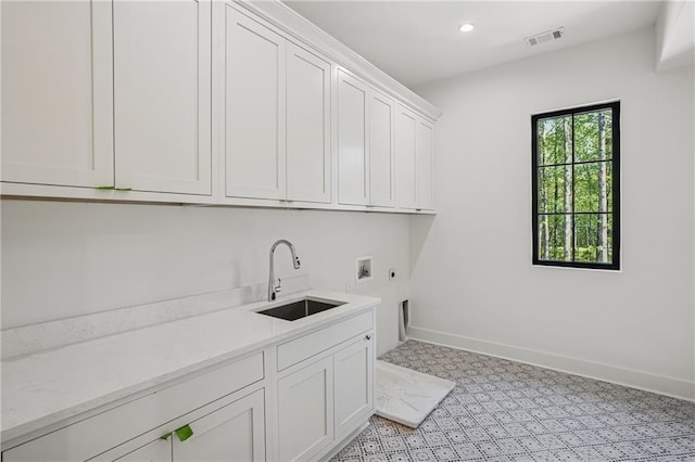 4235 Drew Campground Rd, Alpharetta, GA 30004 - laundry area with electric dryer hookup, cabinet space, washer hookup, baseboards, and recessed lighting