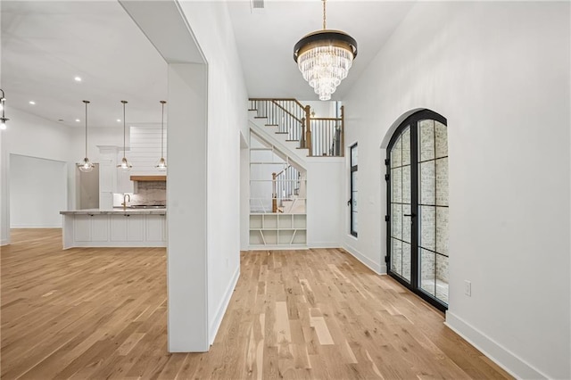 4235 Drew Campground Rd, Alpharetta, GA 30004 - foyer featuring light wood-style flooring, baseboards, a chandelier, and recessed lighting