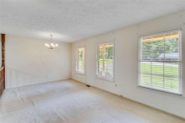 3740 Windy Hill Cir, Gainesville, GA 30504 - carpeted spare room with a chandelier, baseboards, and a textured ceiling