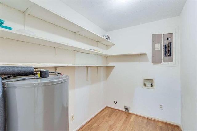 3740 Windy Hill Cir, Gainesville, GA 30504 - laundry room featuring washer hookup, water heater, light wood-type flooring, hookup for an electric dryer, and baseboards