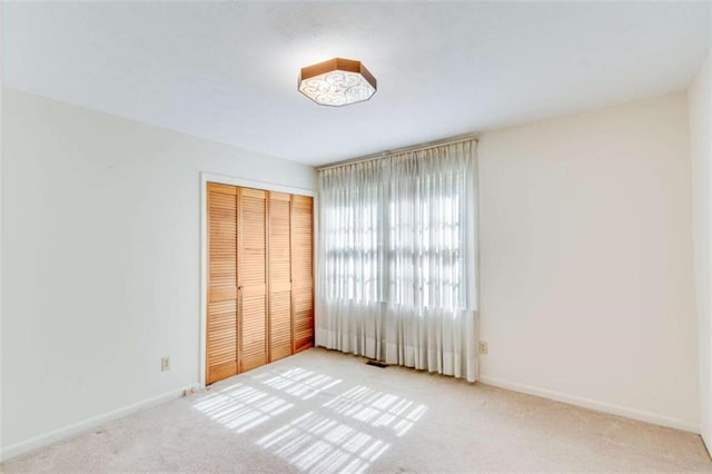 3740 Windy Hill Cir, Gainesville, GA 30504 - unfurnished bedroom featuring carpet flooring, a closet, and baseboards