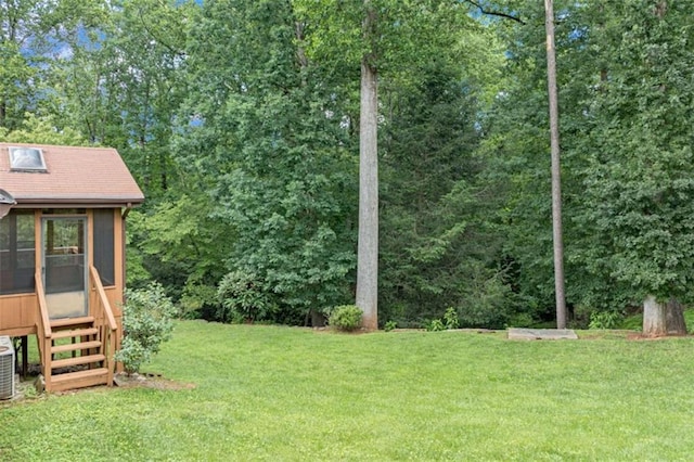 3740 Windy Hill Cir, Gainesville, GA 30504 - view of grassy yard featuring central AC, a sunroom, and entry steps