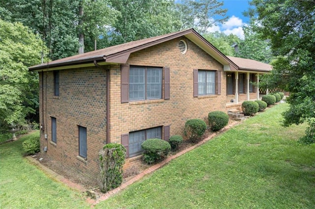 3740 Windy Hill Cir, Gainesville, GA 30504 - view of side of home with brick siding, a lawn, and an attached garage
