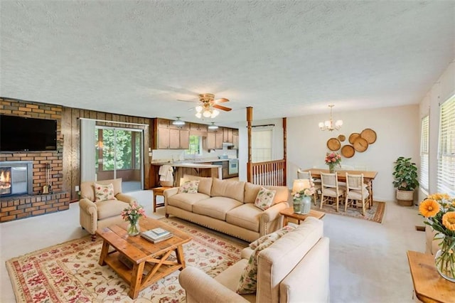 3740 Windy Hill Cir, Gainesville, GA 30504 - living area featuring a textured ceiling, a fireplace, light carpet, ceiling fan, and a chandelier
