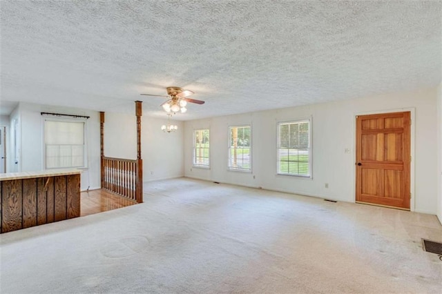 3740 Windy Hill Cir, Gainesville, GA 30504 - unfurnished living room featuring carpet, ceiling fan, and a textured ceiling