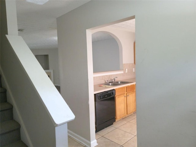 3216 Panthers Trce, Decatur, GA 30034 - interior space with a sink, a textured ceiling, black dishwasher, backsplash, and stairway