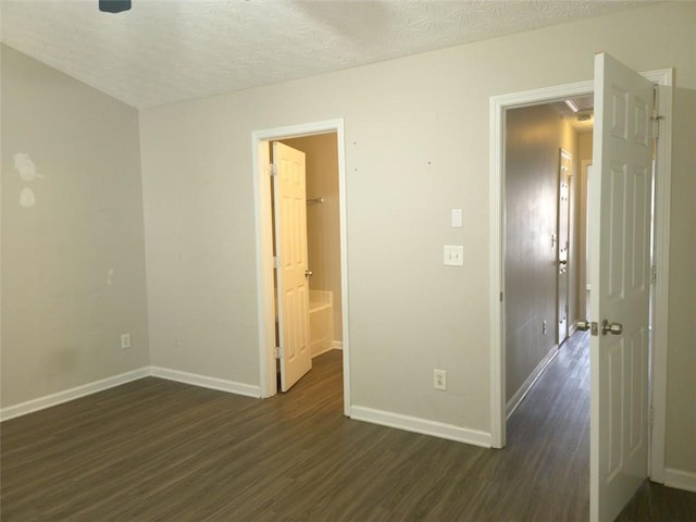 3216 Panthers Trce, Decatur, GA 30034 - spare room featuring baseboards, dark wood-style floors, and a textured ceiling