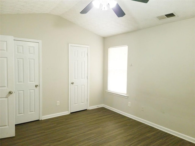 3216 Panthers Trce, Decatur, GA 30034 - unfurnished bedroom featuring ceiling fan, baseboards, lofted ceiling, visible vents, and dark wood-style floors