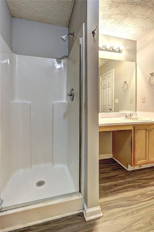 3216 Panthers Trce, Decatur, GA 30034 - bathroom with vanity, baseboards, wood finished floors, and a shower stall