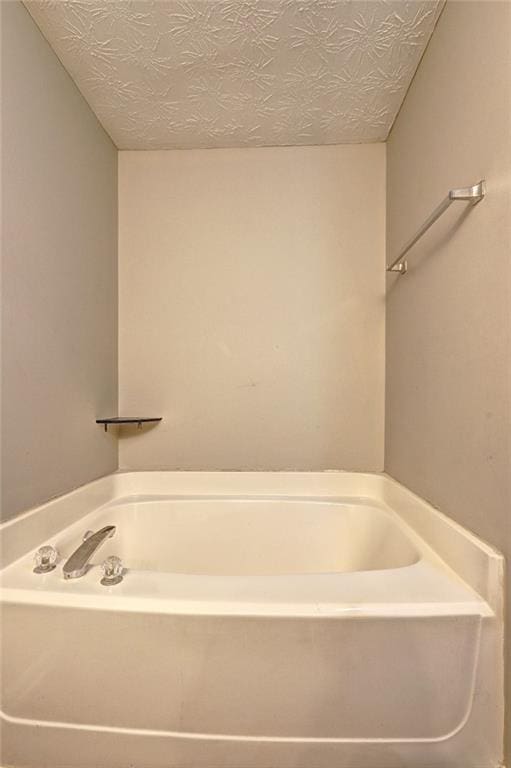 3216 Panthers Trce, Decatur, GA 30034 - bathroom featuring a textured ceiling and a bath