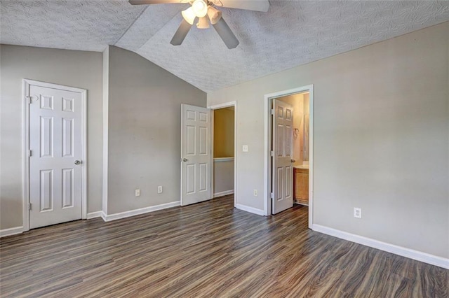 3216 Panthers Trce, Decatur, GA 30034 - unfurnished bedroom featuring lofted ceiling, wood finished floors, baseboards, ensuite bathroom, and a textured ceiling