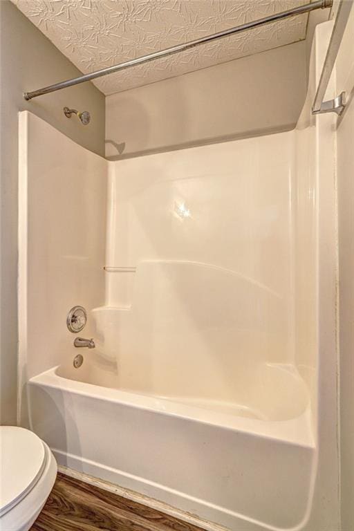 3216 Panthers Trce, Decatur, GA 30034 - full bath featuring shower / bath combination, wood finished floors, and toilet