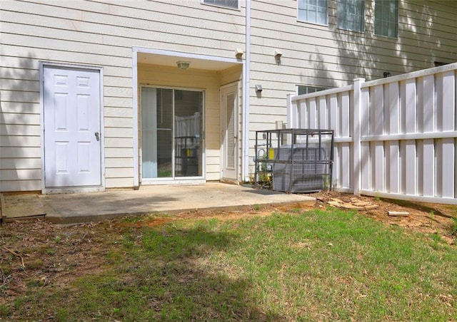 3216 Panthers Trce, Decatur, GA 30034 - view of exterior entry with a lawn, a patio area, and fence