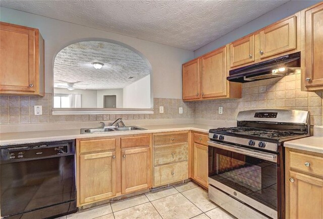 3216 Panthers Trce, Decatur, GA 30034 - kitchen featuring black dishwasher, light countertops, under cabinet range hood, a sink, and gas stove