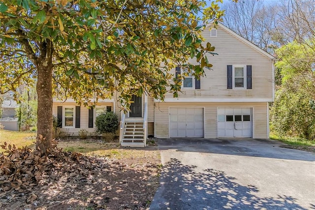 tri-level home featuring driveway and a garage