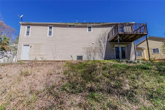back of property with a deck