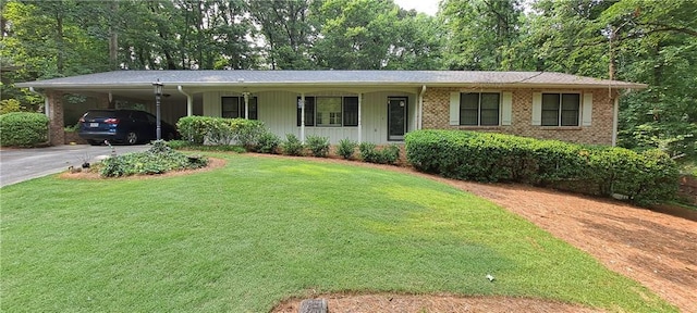 2600 Amberly Dr, Dunwoody, GA 30360 - ranch-style home featuring driveway, a front lawn, brick siding, and an attached carport