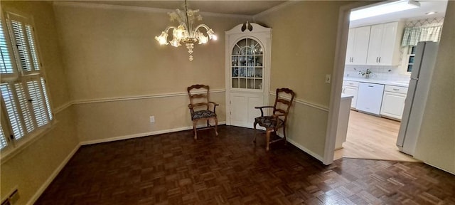 2600 Amberly Dr, Dunwoody, GA 30360 - dining room featuring ornamental molding, a chandelier, and baseboards