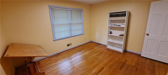2600 Amberly Dr, Dunwoody, GA 30360 - unfurnished bedroom with light wood-style flooring and baseboards