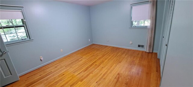 2600 Amberly Dr, Dunwoody, GA 30360 - unfurnished room featuring healthy amount of natural light, light wood-type flooring, and baseboards