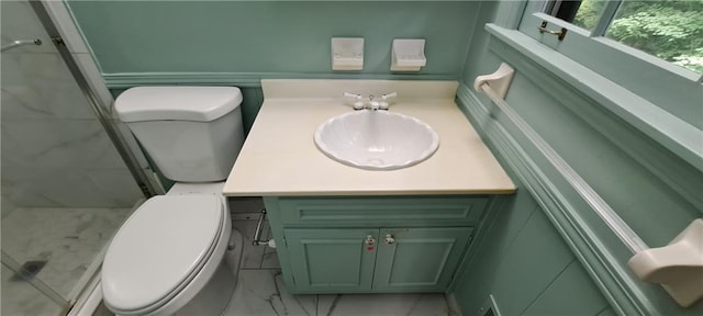 2600 Amberly Dr, Dunwoody, GA 30360 - full bath featuring toilet, marble finish flooring, a stall shower, and vanity
