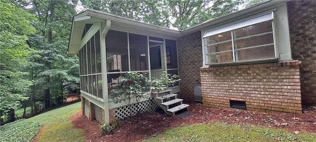 2600 Amberly Dr, Dunwoody, GA 30360 - view of side of property with crawl space, a sunroom, and brick siding
