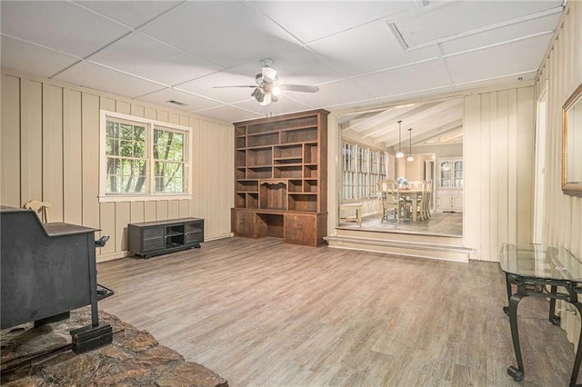 178 Garrison St, Homer, GA 30547 - living area with wood finished floors, a ceiling fan, built in features, and wooden walls