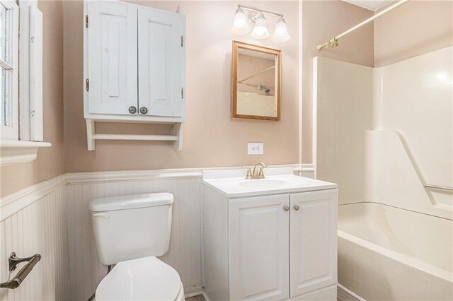 178 Garrison St, Homer, GA 30547 - full bath featuring bathtub / shower combination, a wainscoted wall, and vanity