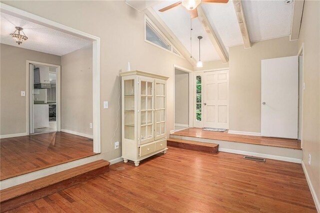 178 Garrison St, Homer, GA 30547 - spare room featuring ceiling fan, wood finished floors, beam ceiling, and high vaulted ceiling