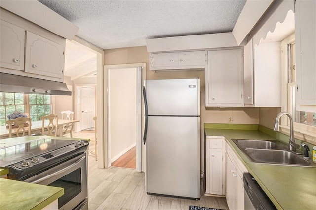 178 Garrison St, Homer, GA 30547 - kitchen with freestanding refrigerator, stainless steel electric stove, exhaust hood, a textured ceiling, and dishwashing machine