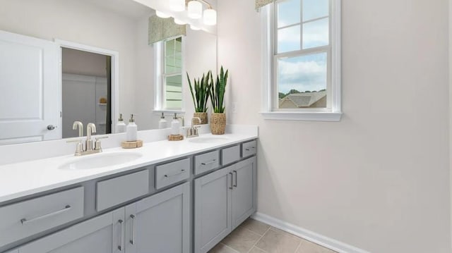 bathroom with tile patterned floors and vanity