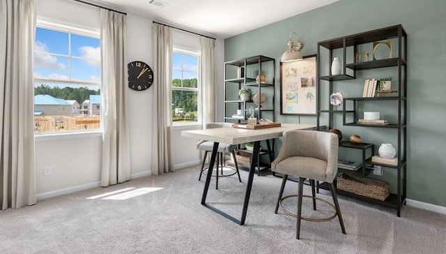 office area with plenty of natural light and carpet floors