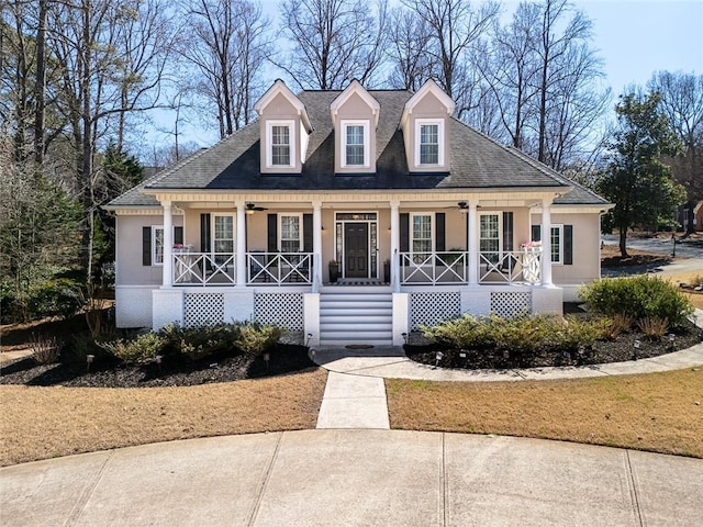 view of front of house featuring a porch, a ceiling fan, and stucco siding