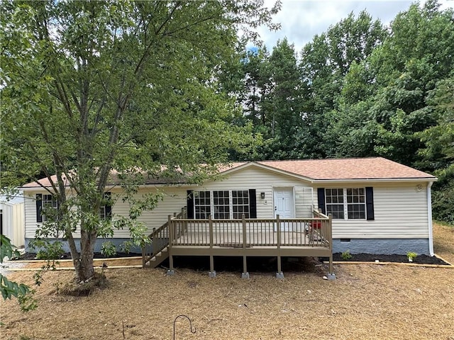 view of front of property with a wooden deck