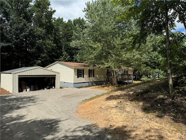 view of front of house featuring a garage and an outdoor structure