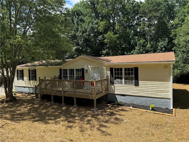 view of front of property with a wooden deck