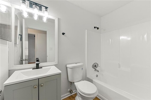 washroom with electric panel, hookup for a washing machine, light hardwood / wood-style floors, and a textured ceiling