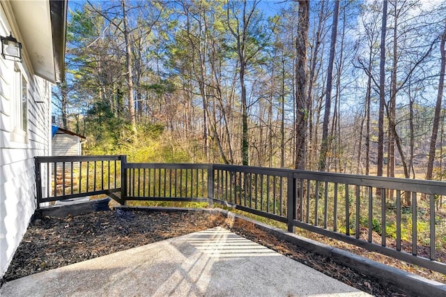 wooden deck with a patio