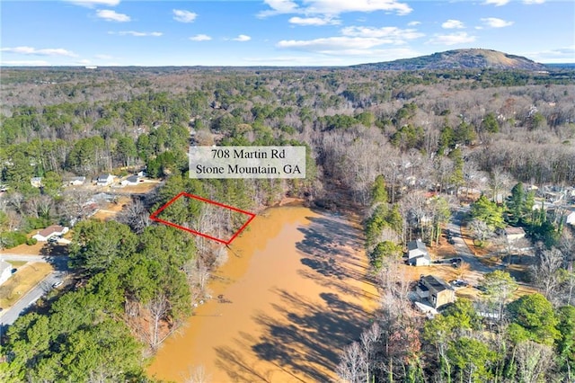 aerial view featuring a water and mountain view