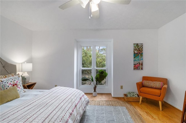 bedroom featuring ceiling fan and light hardwood / wood-style floors