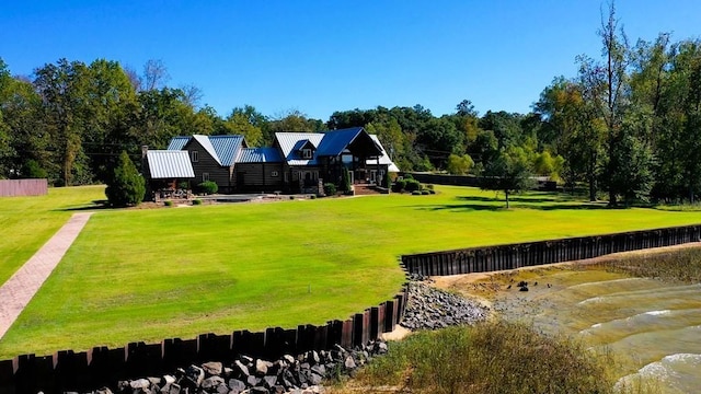 view of property's community with a lawn