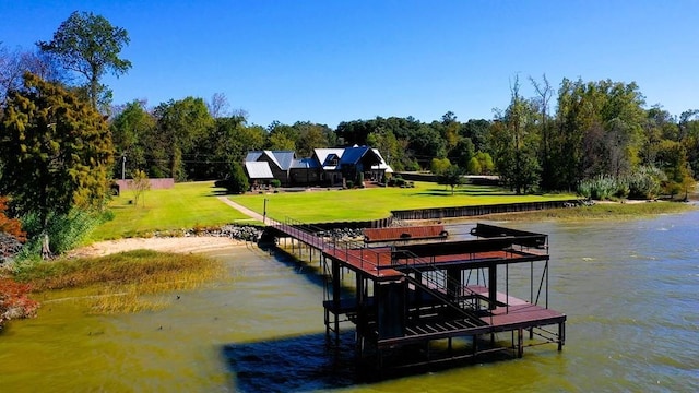 dock with a water view and a lawn