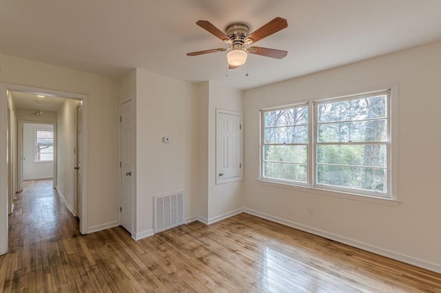 unfurnished bedroom featuring light hardwood / wood-style floors and ceiling fan