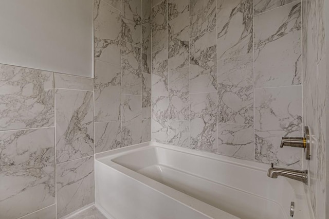 bathroom featuring tub / shower combination and tile walls