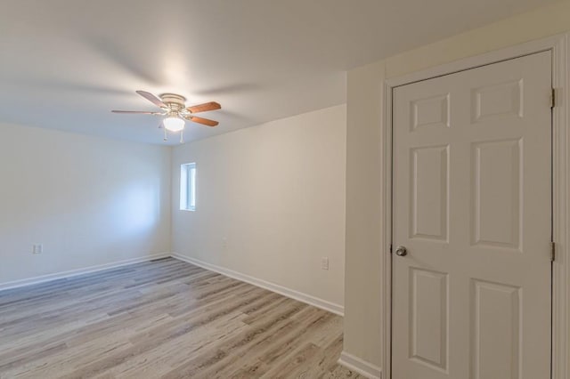 spare room featuring light hardwood / wood-style flooring and ceiling fan